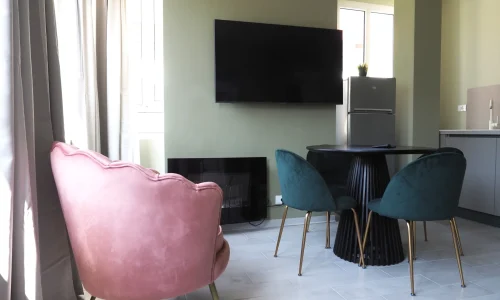 stylish-dining-area-with-tv-and-kitchenette-mont-blanc-suite-torino-loft